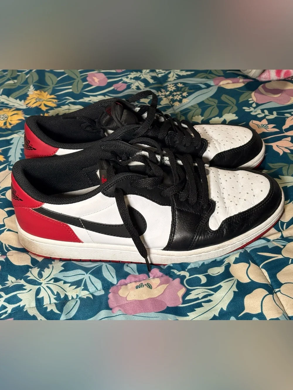 Jordan 1 Low Black and White Sneakers with Red Logo Accent